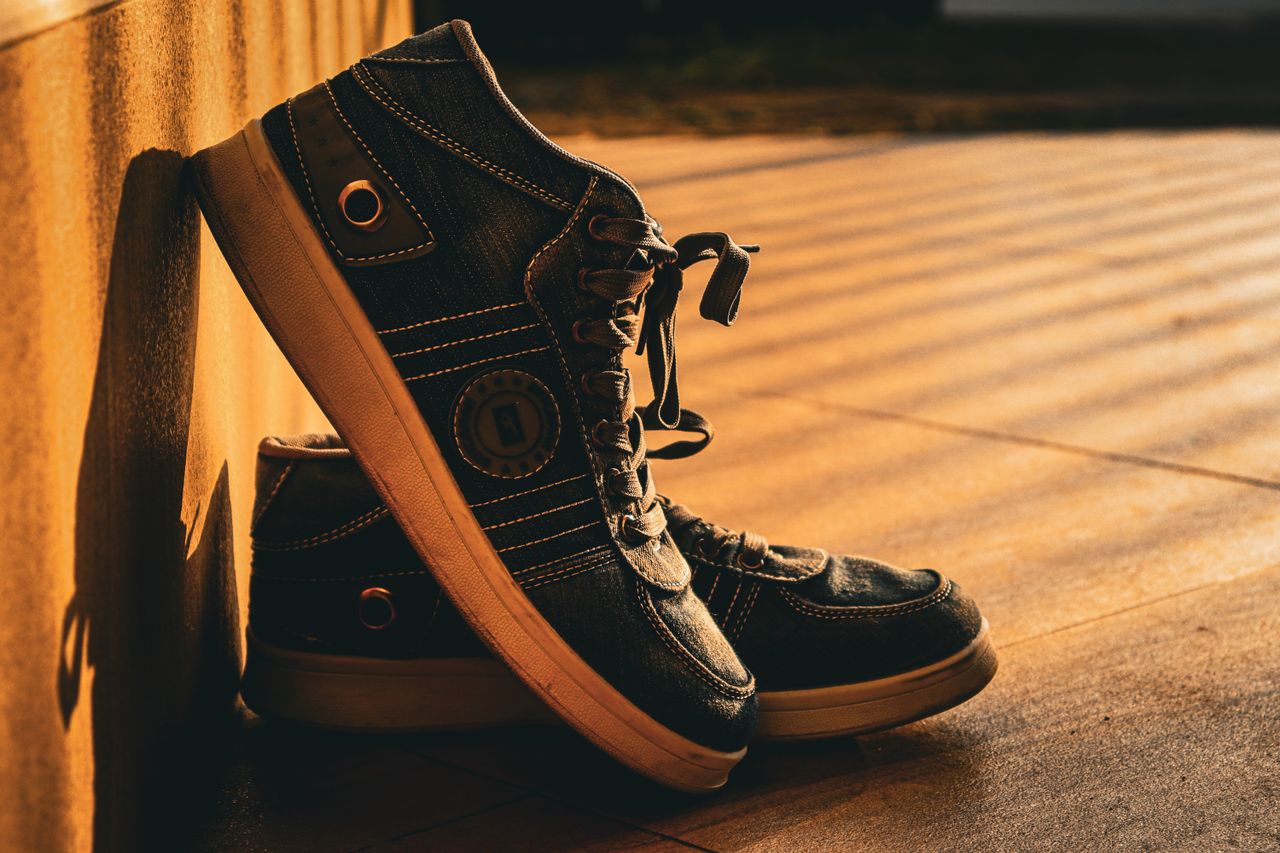 The Art of Drawing Readers In: Your attractive post title goes here Stylish sneakers basking in the warm glow of golden hour sunlight.